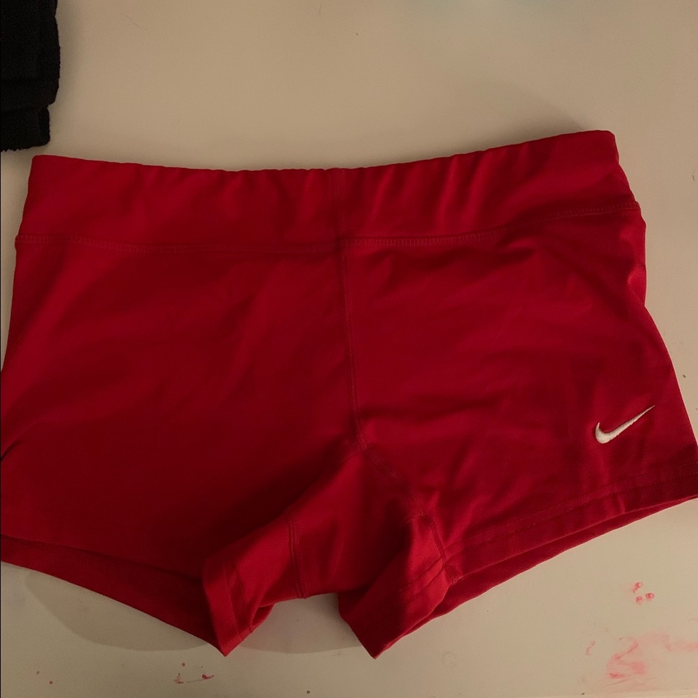 Red Nike shorts